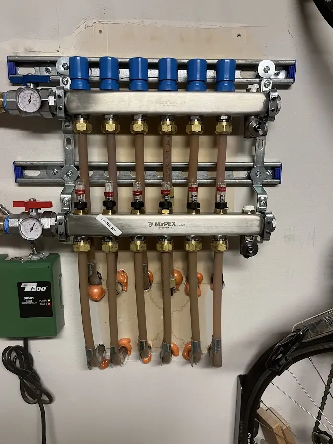 Plumber performing Water Heater Repair at a residential property in Onondaga